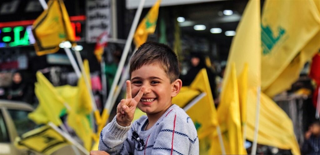 Hezbollah supporters celebrate the formation of the government