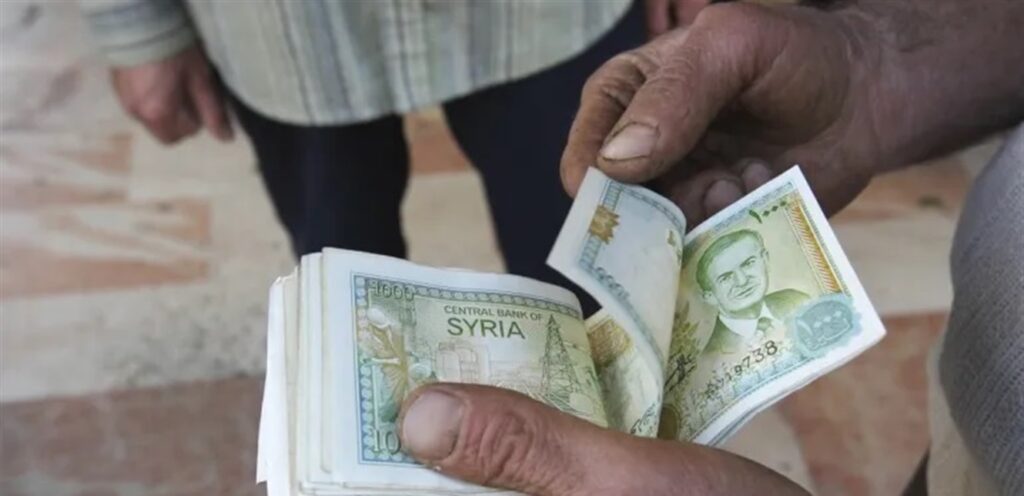 Why is the price of the dollar in Syria higher in the central bank?